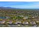 Aerial view of a luxury community with houses, pool, and tennis courts at 7257 E Visao Dr, Scottsdale, AZ 85266