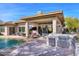 Luxury backyard oasis with pool and outdoor kitchen at 7257 E Visao Dr, Scottsdale, AZ 85266