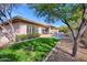 Landscaped backyard with lush grass and mature trees at 7257 E Visao Dr, Scottsdale, AZ 85266