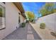 Landscaped backyard with stone path and desert plants at 7257 E Visao Dr, Scottsdale, AZ 85266