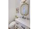 Small bathroom with white vanity and gold mirror at 7257 E Visao Dr, Scottsdale, AZ 85266