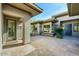 Private courtyard entry with stonework and seating area at 7257 E Visao Dr, Scottsdale, AZ 85266