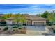 One-story home with a two-car garage and desert landscaping at 7257 E Visao Dr, Scottsdale, AZ 85266