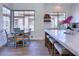 Kitchen breakfast nook with a round table and chairs near large windows at 7257 E Visao Dr, Scottsdale, AZ 85266