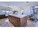 Large kitchen island with ample storage and a view of the Gathering room at 7257 E Visao Dr, Scottsdale, AZ 85266