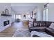 Bright living area with hardwood floors, a fireplace, and an open concept to the kitchen at 7257 E Visao Dr, Scottsdale, AZ 85266