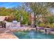 Outdoor kitchen with built-in grill and stone countertops at 7257 E Visao Dr, Scottsdale, AZ 85266