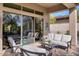 Relaxing covered patio with comfortable seating and views of the backyard at 7257 E Visao Dr, Scottsdale, AZ 85266