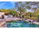 Relaxing pool area with built-in BBQ and landscaped surroundings at 7257 E Visao Dr, Scottsdale, AZ 85266