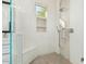 Modern tiled shower featuring a built-in bench, shower niche and neutral mosaic tile accent wall at 7257 E Visao Dr, Scottsdale, AZ 85266