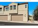 Tan two-story townhome with two-car garage at 730 E Zesta Ln # 101, Gilbert, AZ 85297