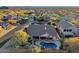 Aerial view of a house with a pool and patio at 7920 E Sierra Morena E Cir, Mesa, AZ 85207