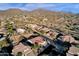 Aerial view of house and surrounding mountain views at 7920 E Sierra Morena E Cir, Mesa, AZ 85207