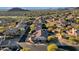 Aerial view of a house with a pool in a mountainside community at 7920 E Sierra Morena E Cir, Mesa, AZ 85207