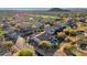 Aerial view of a house with a pool and putting green at 7920 E Sierra Morena E Cir, Mesa, AZ 85207