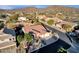 Aerial view of a house in a residential neighborhood with mountain views at 7920 E Sierra Morena E Cir, Mesa, AZ 85207