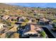 Aerial view of a house with a pool in a mountainside community at 7920 E Sierra Morena E Cir, Mesa, AZ 85207