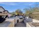 Outdoor kitchen with grill, sink, and stone countertop at 7920 E Sierra Morena E Cir, Mesa, AZ 85207