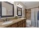 Bathroom with granite countertop and double sinks at 7920 E Sierra Morena E Cir, Mesa, AZ 85207