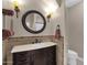 Elegant bathroom with a dark vanity and tiled accents at 7920 E Sierra Morena E Cir, Mesa, AZ 85207