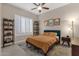 Cozy bedroom with a wooden bed frame and window shutters at 7920 E Sierra Morena E Cir, Mesa, AZ 85207