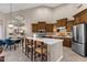 Modern kitchen with dark wood cabinets and a large island at 7920 E Sierra Morena E Cir, Mesa, AZ 85207