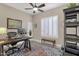 Home office with built-in shelving and large window at 7920 E Sierra Morena E Cir, Mesa, AZ 85207