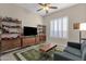 Mid-century modern play room features built-in shelving and a comfortable couch at 7920 E Sierra Morena E Cir, Mesa, AZ 85207