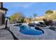 Inviting kidney-shaped pool with a spa and waterfall feature at 7920 E Sierra Morena E Cir, Mesa, AZ 85207