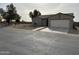 House exterior featuring a front yard and driveway at 805 W Raymond St, Coolidge, AZ 85128