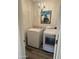 Laundry room with washer, dryer, and chandelier at 805 W Raymond St, Coolidge, AZ 85128