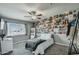 Cozy bedroom with a ceiling fan and a large window offering natural light at 8149 W Daley Ln, Peoria, AZ 85383