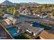 Aerial view of house, pool, and backyard; plus surrounding neighborhood at 8235 E Glenrosa Ave, Scottsdale, AZ 85251