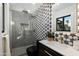 Modern bathroom with geometric tile and gold accents at 8235 E Glenrosa Ave, Scottsdale, AZ 85251