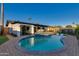 Inviting kidney-shaped pool with spa and brick patio at 8235 E Glenrosa Ave, Scottsdale, AZ 85251