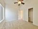 Bright bedroom with ceiling fan and window, and large closet at 9561 W Debbie Pl, Arizona City, AZ 85123