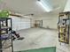 Two-car garage with shelving and ample storage space at 9561 W Debbie Pl, Arizona City, AZ 85123