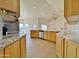 Spacious kitchen featuring granite countertops and ample cabinetry at 9561 W Debbie Pl, Arizona City, AZ 85123