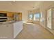 Bright kitchen nook with large windows and patio door access at 9561 W Debbie Pl, Arizona City, AZ 85123