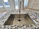 Stainless steel sink with granite countertop at 9561 W Debbie Pl, Arizona City, AZ 85123