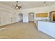 Open living room with high ceilings and built-in shelving at 9561 W Debbie Pl, Arizona City, AZ 85123