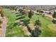 Aerial view of a golf course community with homes and lush landscaping at 9729 W Pinecrest Dr, Sun City, AZ 85351