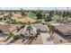 Aerial view showing a home with a golf course view in a residential area at 9729 W Pinecrest Dr, Sun City, AZ 85351