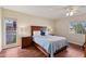 Bedroom with wood flooring and a ceiling fan at 9729 W Pinecrest Dr, Sun City, AZ 85351