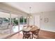 Dining area with sliding glass doors leading to the patio at 9729 W Pinecrest Dr, Sun City, AZ 85351