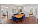 Bright dining room with hardwood floors and seating for six at 9729 W Pinecrest Dr, Sun City, AZ 85351