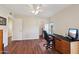 Bright home office with hardwood floors and built-in desk at 9729 W Pinecrest Dr, Sun City, AZ 85351