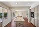 Open concept kitchen with island and view into the dining area at 9729 W Pinecrest Dr, Sun City, AZ 85351