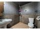 Bathroom with gray tile and walk-in shower at 1011 N Vista Rd, Apache Junction, AZ 85119