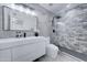 Modern bathroom with white vanity, grey tile shower, and stylish lighting at 10115 E Mountain View Rd # 2022, Scottsdale, AZ 85258